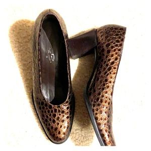 Women snake skin shoes.